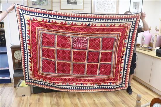 A collection of 19th century Indian silk embroidered and woven textiles